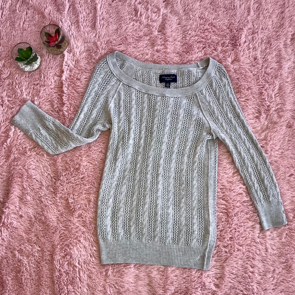 grey knit sweater.